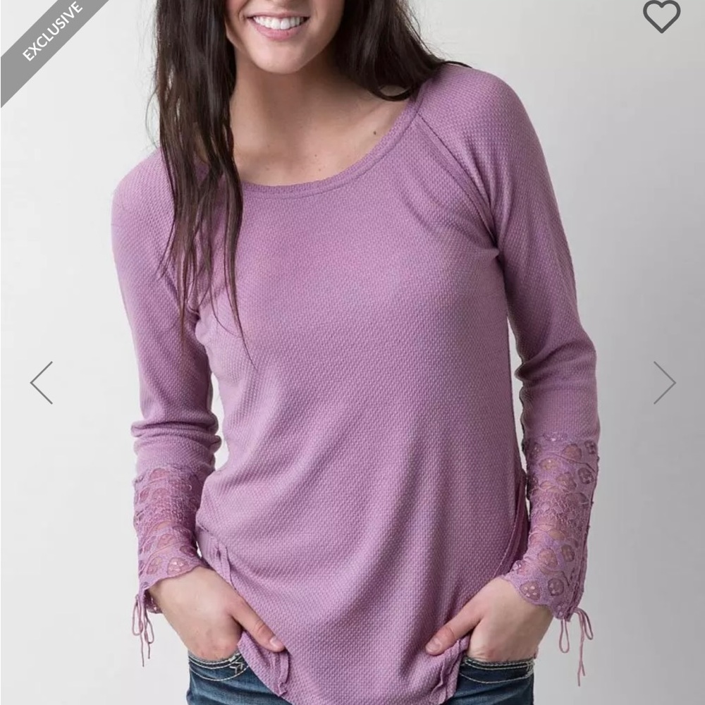 Woman’s top size small lace up detail sleeves